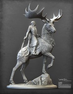 a statue of a man riding on the back of a horse next to an antelope