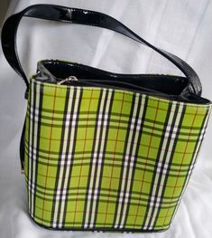 Vintage green tartan or checked purse with strap. This unique purse has a flat bottom which is 5.4"x7.9". There are 2 sides inside the purse separated by a zippered area for extra storage. There is also a side zipper on one side. The purse is green, black, white and red checked. There are a bit of imperfections on the pattern but no rips. The strap is black plastic. Length 8.2", height 7.8" This item will be sent tracked package within Canada. Outside Canada this item will be sent International Green Tartan Handbag With Burgandy Handles, Green Tartan Handbag, Fancy Purses, Green Tartan, Unique Purses, Black Plastic, Extra Storage, Air Mail, Cross Body Handbags