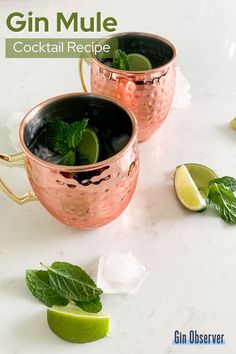 two copper mugs with mint and lime garnish