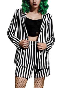 a woman with green hair wearing a black and white striped jacket, shorts and fishnet stockings