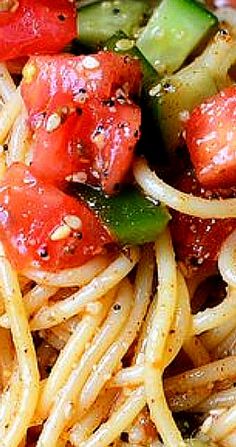 pasta with tomatoes, cucumbers and onions in a tomato sauce