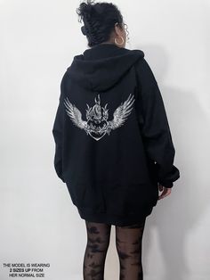 We are loving our full zip oversized hoodie! It's a perfect goth hoodie or even grunge hoodie! It can even be styled to more of a soft goth emo style. Check out our shop for more styles! This oversized full zip up hoodie is so cozy and oversized that you won't want to take off! Most people go 1-2 sizes up from their normal size to get the oversized look. Cute, comfortable and trendy -- a necessity for any aesthetic clothing collection! The material is the classic gildan medium weight hoodie mate Goth Zip Up Hoodie, Giant Hoodie Outfit, Emo Hoodie Outfit, Black Emo Hoodie For Streetwear, Oversized Y2k Hoodie, Black Oversized Y2k Hoodie, Oversized Hooded Y2k Outerwear, Gothic Hoodie For Winter Streetwear, Gothic Sweatshirt For Winter Streetwear