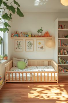 a small child's room with bookshelves and toys on the shelves above