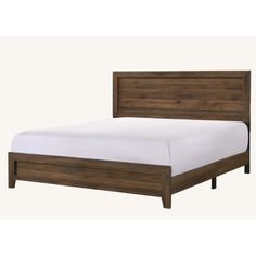 a wooden bed frame with white sheets and pillows