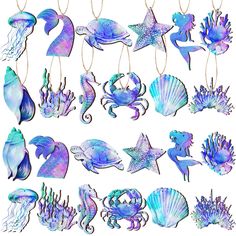 an assortment of sea animals hanging from strings on a white background with blue and purple colors