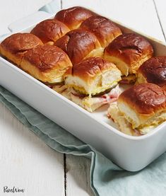 a pan filled with ham and cheese sliders