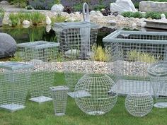 several wire baskets are arranged on the grass