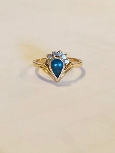 Pear shape blue topaz with six accent diamond in 18K yellow gold. December Birthstone. Engagement ring. Ladies' ring. Ladies Ring, December Birthstone, Pear Shape, Pear Shaped, Blue Topaz, Women Rings, Birthstone, Heart Ring, Topaz