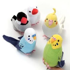 several small stuffed birds sitting next to each other