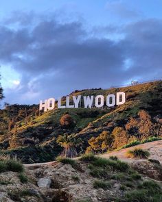 the hollywood sign is on top of a hill