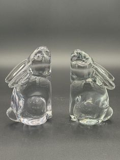 Add a touch of whimsy to your bookshelf with these charming glass bunny rabbit bookends from Selvestri. Crafted from clear glass and measuring 6 inches in length, these bookends are perfect for any book lover who wants to add some personality to their home décor. The playful design features two adorable bunnies, making these bookends not only functional but also a delightful decorative piece. Price includes set of bookends no chips or cracks. One bunny has more of a bluish tint than the other. Beautiful and unique Aprox size 6in tall x 3.5in x 2.5in Rabbit Bookends, Adorable Bunnies, Cute Bunny, Playful Design, Bunny Rabbit, Book Lover, Bookends, Decorative Pieces, 6 Inches