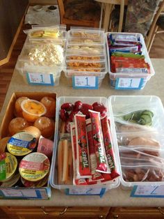 some food is sitting in plastic containers on a table with the words lunches all ready just waiting to fill one more bin see more