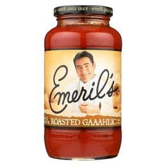 a jar of tomato sauce with the label emerils roasted garlic on it's side