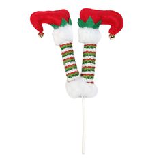 two christmas candy lollipops with santa hats and stockings on them, one is green and the other is red