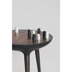 a wooden table with black and white squares on it