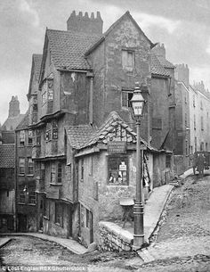 an old black and white photo of some buildings