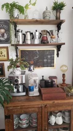 a coffee bar with lots of cups and saucers on the shelves next to it