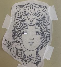 a piece of paper with a drawing of a woman and a tiger on it's face