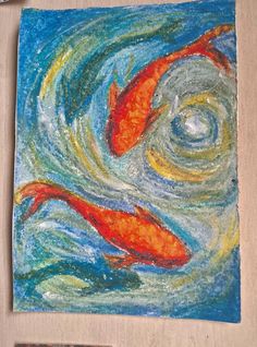 an art project with colored pencils and watercolor paints on the paper, depicting two koi fish swimming in a pond