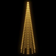 a lighted christmas tree in the dark with lights on it's top and bottom