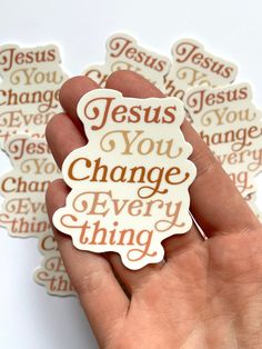 a hand holding a sticker with the words jesus you change every thing on it