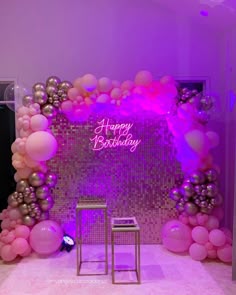 a pink and silver birthday party with balloons