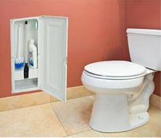 a white toilet sitting in a bathroom next to a wall mounted cabinet with an open door