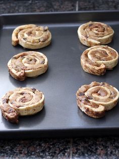 chocolate chip cinnamon rolls on a cookie sheet ready to go in the oven for baking