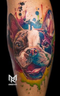 a tattoo with a dog's face painted on it