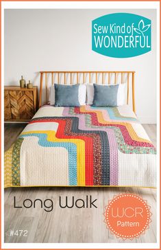 a bed with a colorful quilt on it and the words sew kind of wonderful