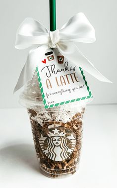 there is a starbucks cup with a white bow on it that says thanks a latte for everything you do