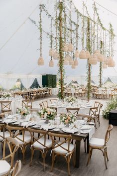 a large tent with tables and chairs set up for an event