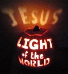 the light of the world is shining on an orange ball with jesus's name