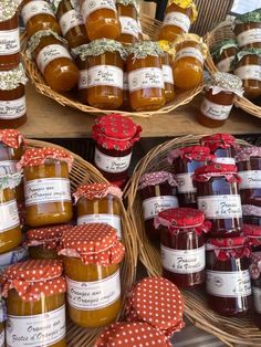 several baskets filled with jams sitting next to each other