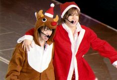 two people dressed up in reindeer costumes