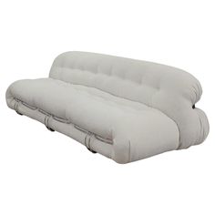 a white couch sitting on top of a wooden floor