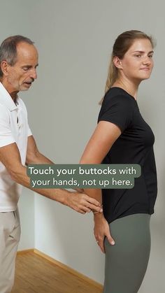 an older man holding the back of a woman's leg with both hands, not up here