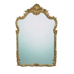 an ornate gold framed mirror against a white background