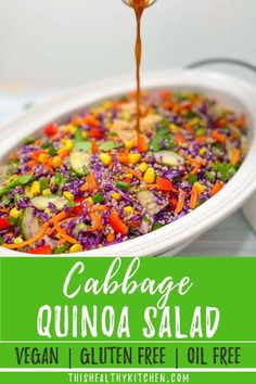 cabbage quinoa salad with carrots, green beans and avocado in a white casserole dish