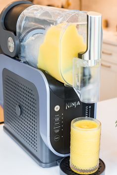 a blender with some juice in it on a counter