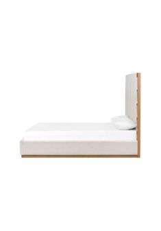 a white bed with a wooden headboard and foot board