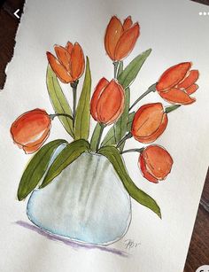 a drawing of orange flowers in a vase on a wooden table next to a piece of paper