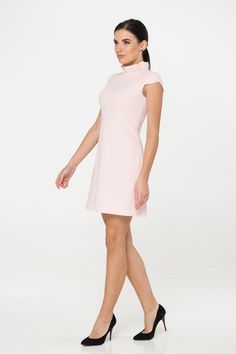 "A pale pink mini dress featuring a frill mock neck, cap sleeves, empire waist, viscose lining, concealed back zipper closure, and a trapeze silhouette. - empire waist - ruffled high neck - short cap sleeves - a line silhouette - concealed back zipper closure - above the knee length (mini) - fully lined Color: pale pink Fiber: 40% viscose, 55% polyester, 5% elastane Lining - 95% viscose, 5 % elastane. For size S: length- 34,5\" (88 cm) Our model wears size S (US 6) and is 171cm/5'6\" tall. You m Feminine A-line Mini Dress, Chic Cap Sleeve Mini Dress For Spring, Elegant High Neck Dresses For Spring, High Neck Mini Dress For Spring Evening, Formal High Neck Mini Dress For Summer, Feminine Short Sleeve Mini Dress For Formal Occasions, Spring Evening High Neck Mini Dress, Spring Evening Mini Dress With High Neck, Formal Short Sleeve Feminine Mini Dress