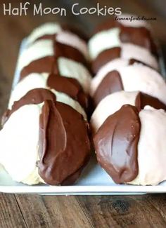 chocolate covered donuts are on a white plate