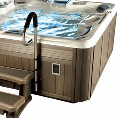 an outdoor hot tub with steps leading up to it