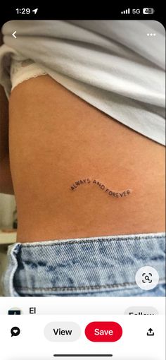 the back of a woman's stomach with an inscription on it that reads, life is