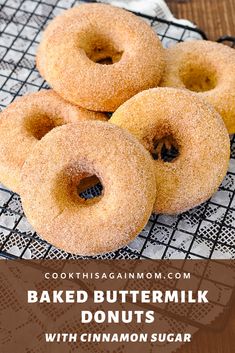 baked buttermilk doughnuts with cinnamon sugar on a cooling rack for baking