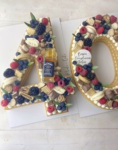 a cake shaped like the number forty with fruit and nuts