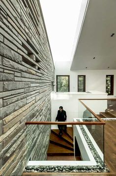 a person sitting on the stairs in a house