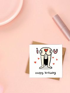 a card with a cartoon cat on it and the words happy birthday written in black